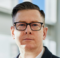 Photographie d'Alexander Hughes, directeur général d'un organisme spécialisé dans le négoce de cryptomonnaies